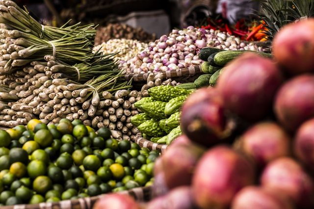 Colorful produce on a farmers market table.